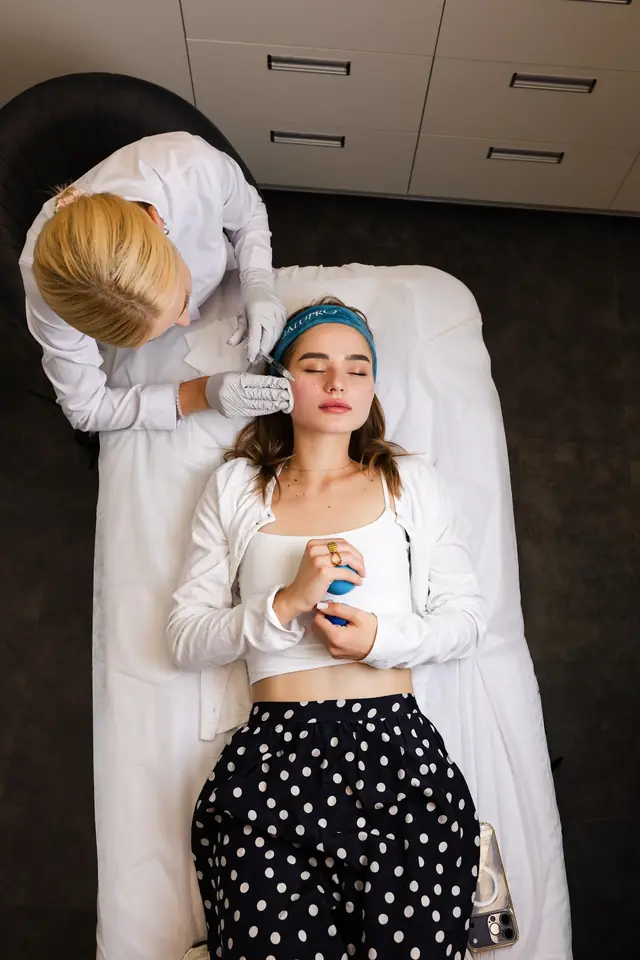 Facial work with the client reclined